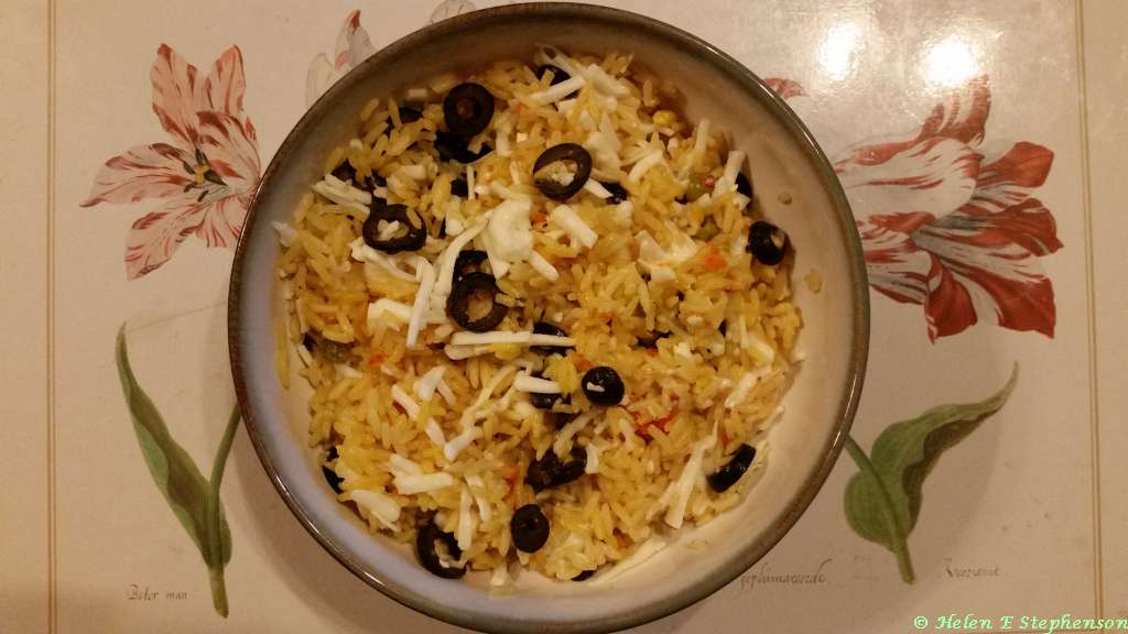 Uncle Ben's Golden Vegetable Rice with chopped black olives and grated vegan cheese